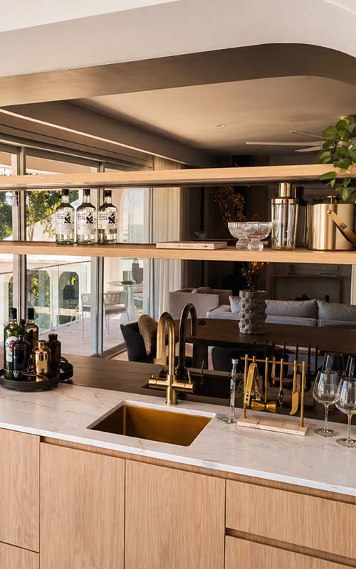 Dark glass splashback in modern kitchen