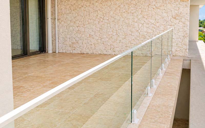 Framed glass balustrading on outdoor balcony