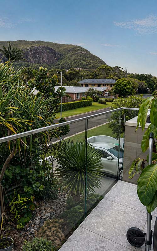 Semi-frameless glass balustrading overlooking landscaped gardens