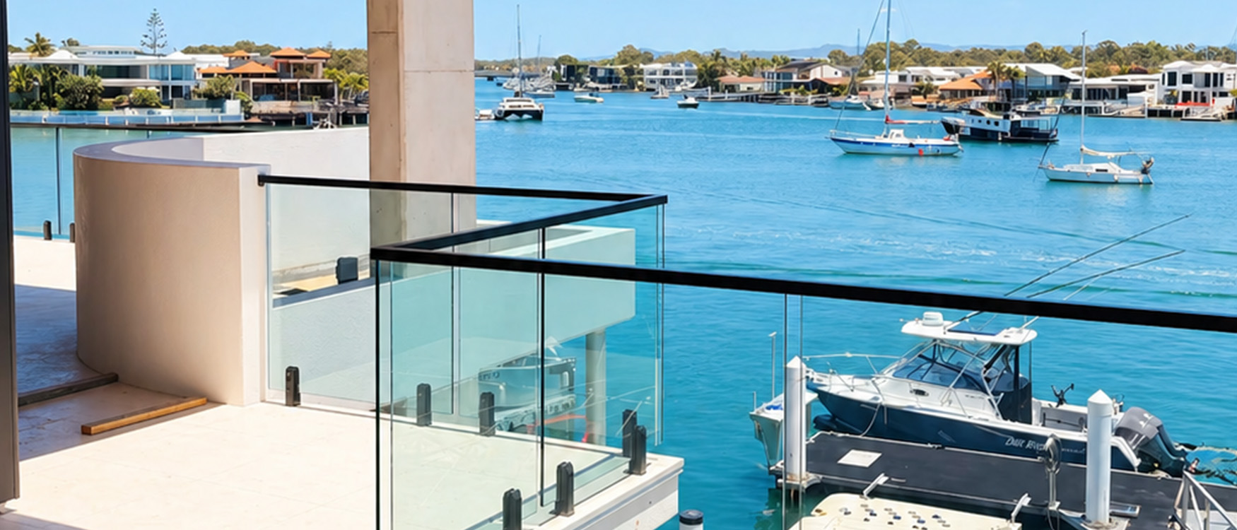 Glass balustrading overlooking waterfront